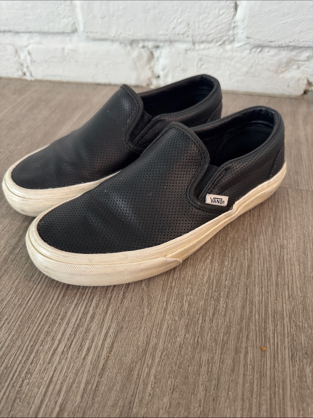 Vans Black Perforated Leather Slip-On Sneakers